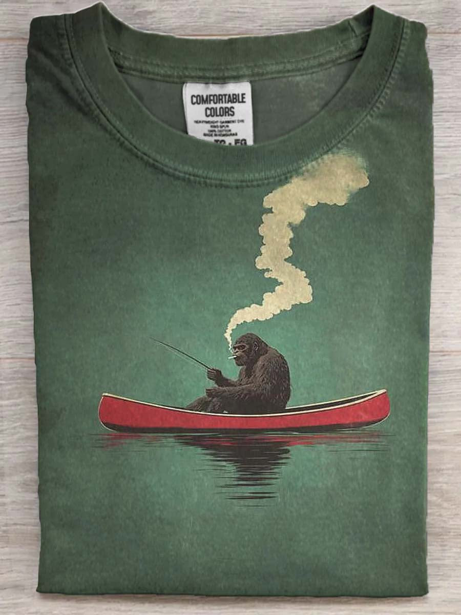 Funny Bigfoot Fishing Print Casual Short-Sleeve T-Shirt on a Red Canoe