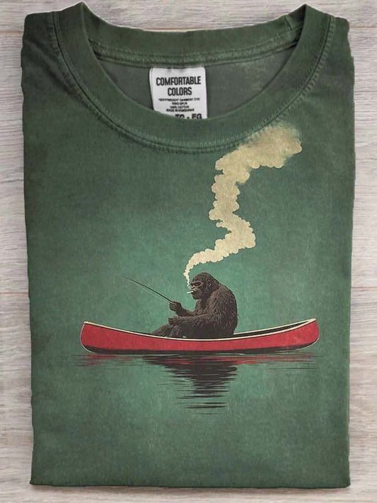 Funny Bigfoot Fishing Print Casual Short-Sleeve T-Shirt on a Red Canoe